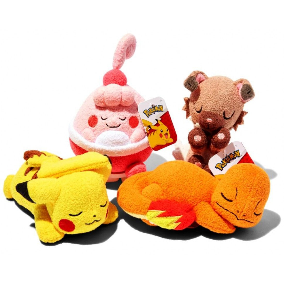 Group photo of four 5-inch Pokémon ‘Sleeping’ plush toys on a white background: Pikachu lying on its tummy, Charmander curled around its tail flame, a pink Happiny snoozing upright, and Rockruff dozing while sitting. Each plush has closed eyes, soft textured fabric, and an official Pokémon tag.
