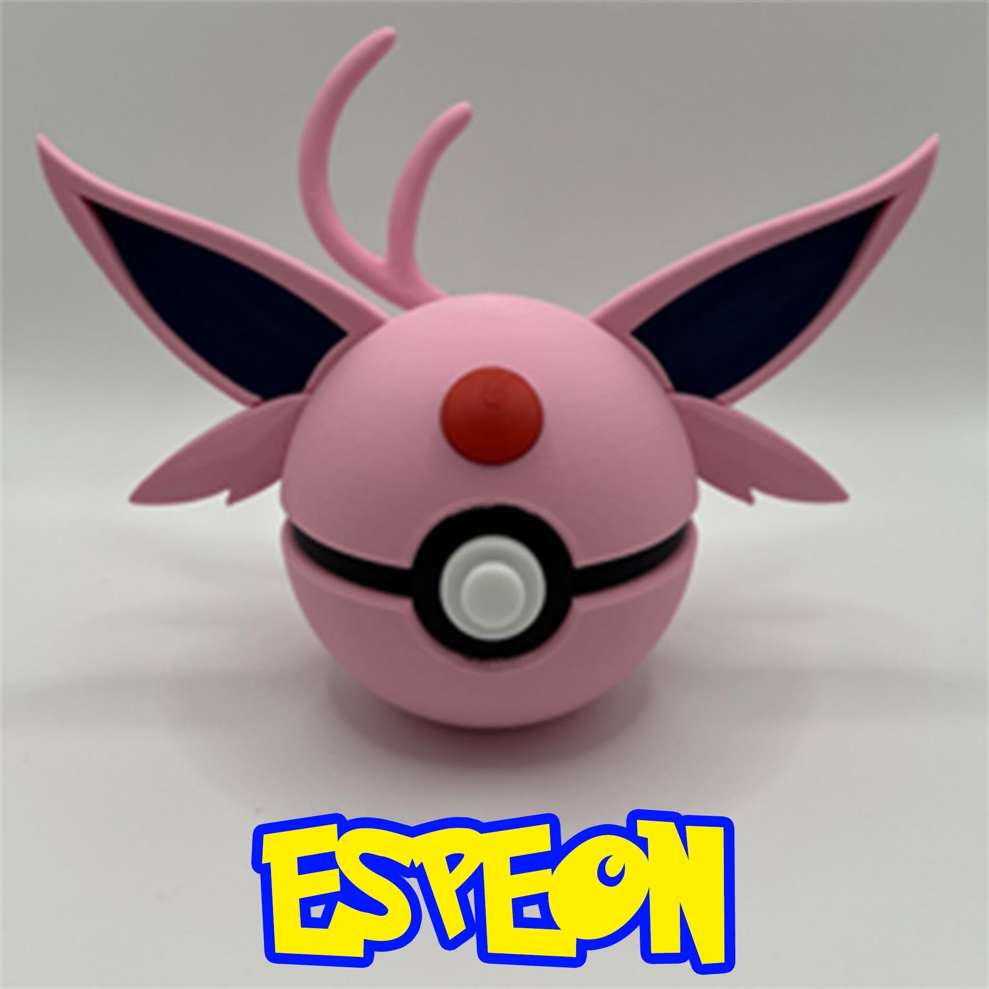 3D printed Espeon Pokéball design with large purple ears, red forehead gem, and playful pink finish