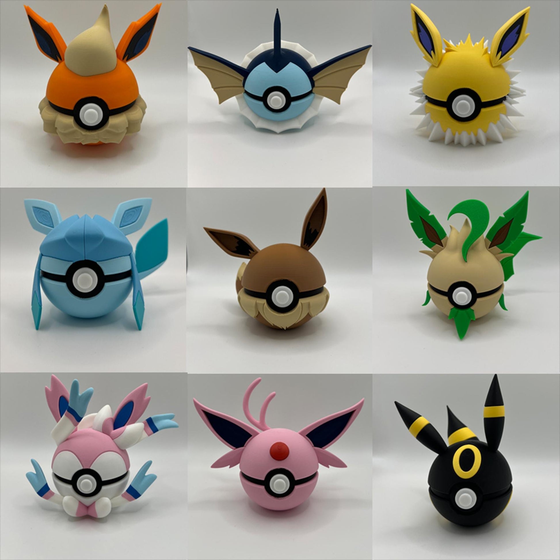 Full set of 3D printed Eeveelution Pokéballs featuring all 9 designs – Espeon, Flareon, Glaceon, Jolteon, Leafeon, Sylveon, Umbreon, Vaporeon, and Eevee – displayed against a plain background.