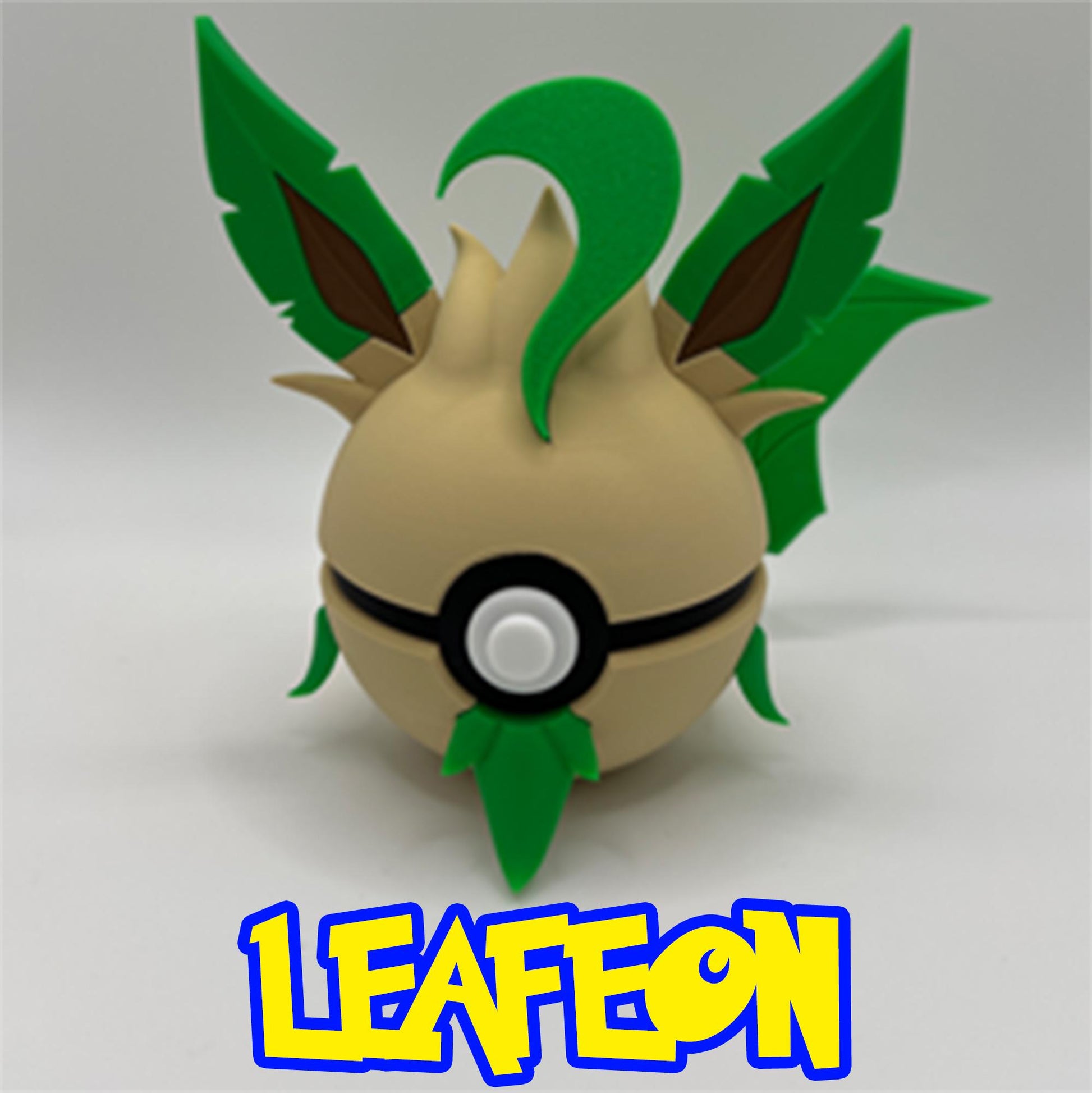 Leafy 3D Leafeon Pokéball design with green leaf ears and accents on a light tan base.