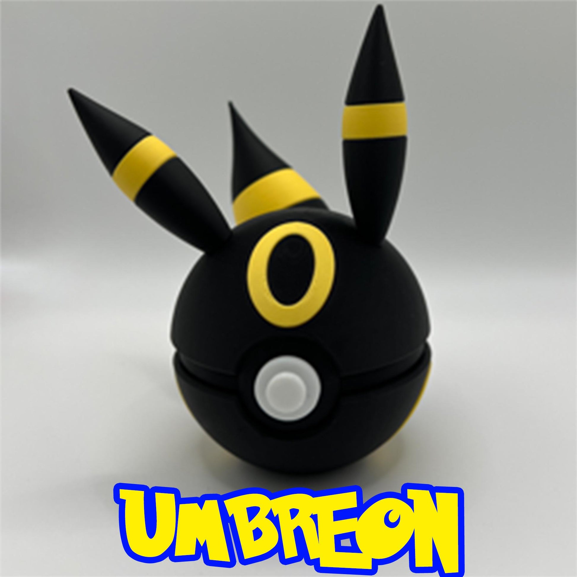 Sleek black Umbreon Pokéball with yellow rings and pointed ears, made with smooth matte 3D printing.
